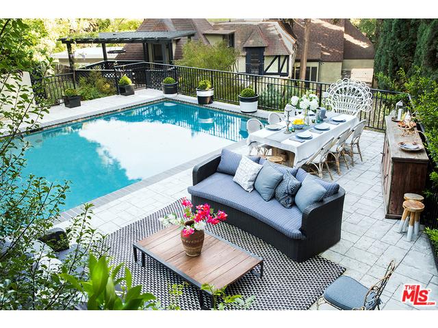 large balcony with poolside area